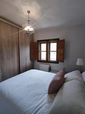 Cama o camas de una habitación en La casa de los Abuelos