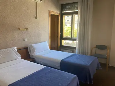 Cama o camas de una habitación en Hotel Condal