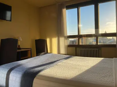 Cama o camas de una habitación en Hotel Condal