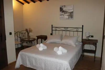 Cama o camas de una habitación en La Muralla de Gredos Hotel Rural