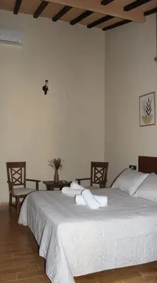 Cama o camas de una habitación en La Muralla de Gredos Hotel Rural