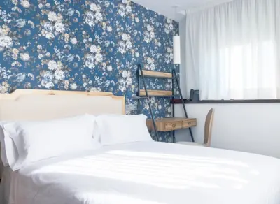 Cama o camas de una habitación en Christine Boutique Hotel