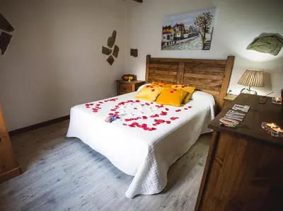 Cama o camas de una habitación en Casa Spa El Capricho de Miguel