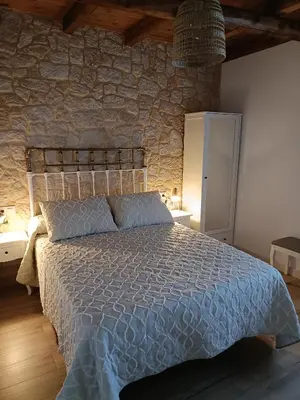 Cama o camas de una habitación en Casa Rural Rio la Puente