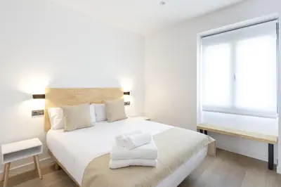 Cama o camas de una habitación en Apartamentos Turísticos D10