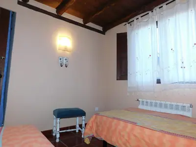 Cama o camas de una habitación en Casa Rurales Cimera y Brincalobitos
