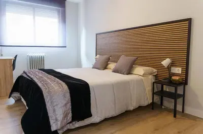 Cama o camas de una habitación en Encantador piso a 7 min de Salamanca by beBalmy