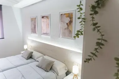 Cama o camas de una habitación en Encantador piso a 7 min de Salamanca by beBalmy