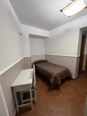 Cama o camas de una habitación en Hostal Hueso
