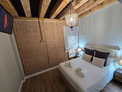 Cama o camas de una habitación en El capricho Balcón en la Plaza Mayor Salamanca Collection Luxury