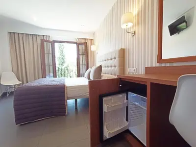 Cama o camas de una habitación en Hotel Rambla Emérita, centro ciudad