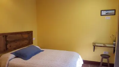 Cama o camas de una habitación en El Condado Casa Rural