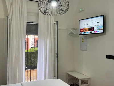 Una televisión o centro de entretenimiento en Apartamento Casa Nela