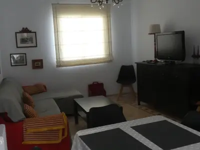 Una televisión o centro de entretenimiento en Casa Ledo