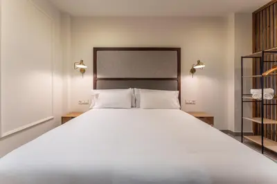 Cama o camas de una habitación en Apartamentos Turísticos GÁLEA
