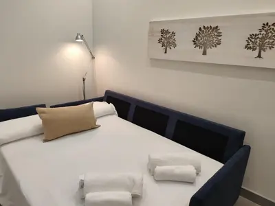 Cama o camas de una habitación en Apartamentos La Montehermoseña