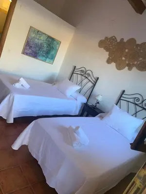 Cama o camas de una habitación en Hosteria La Higuera H-CC-798