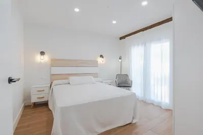 Cama o camas de una habitación en Encantos del Jerte Apartamentos