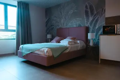 Cama o camas de una habitación en Apartamentos La Posada