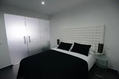 Cama o camas de una habitación en Apartamentos Torrecilla