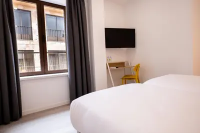 Cama o camas de una habitación en Hotel Gran Vía by gaiarooms