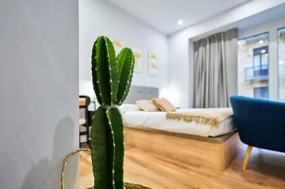 Cama o camas de una habitación en Apartamentos Esperanza by gaiarooms