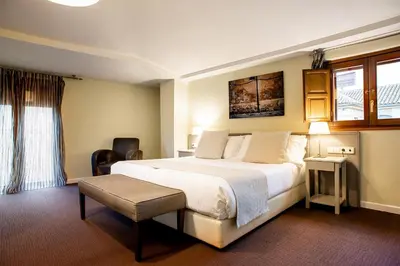 Cama o camas de una habitación en Ikonik Plaza Mercado