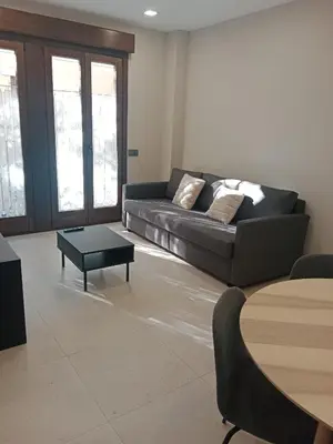 Zona de estar de Apartamentos Living Libreros