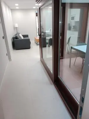 Zona de estar de Apartamentos Living Libreros