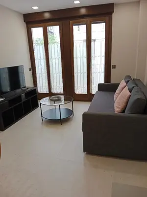 Zona de estar de Apartamentos Living Libreros