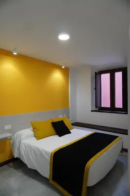 Cama o camas de una habitación en APARTAMENTO Sanin 2