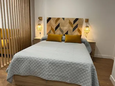 Cama o camas de una habitación en AT Pasaje Sancti Spiritus 1