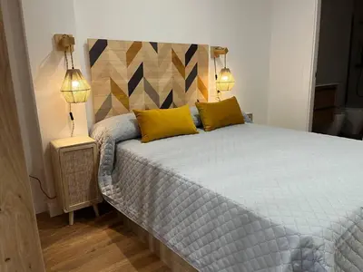Cama o camas de una habitación en AT Pasaje Sancti Spiritus 1