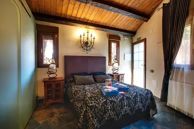 Cama o camas de una habitación en CASA DE CUCU Navaluenga
