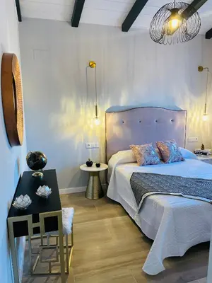 Cama o camas de una habitación en Alojamientos Singulares Maestro24