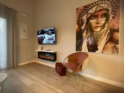 Una televisión o centro de entretenimiento en Alojamientos Singulares Maestro24