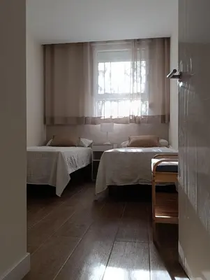 Cama o camas de una habitación en Amplio y tranquilo apartamento casa
