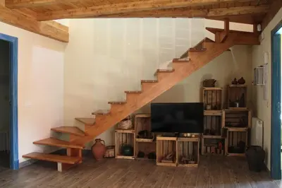 Una televisión o centro de entretenimiento en Casa Rural El Peral