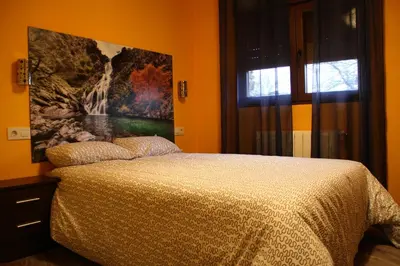 Cama o camas de una habitación en Casa Rural El Peral