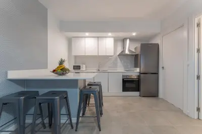 Una cocina o zona de cocina en Apartamentos Turísticos Lulú