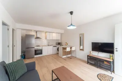 Una cocina o zona de cocina en Apartamentos Turísticos Lulú
