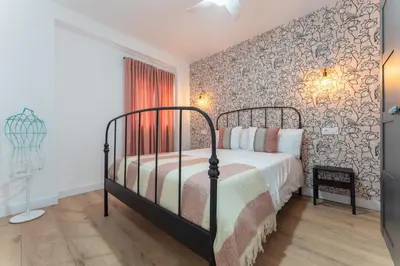Cama o camas de una habitación en Apartamentos Turísticos Lulú