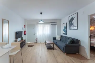 Una televisión o centro de entretenimiento en Apartamentos Turísticos Lulú