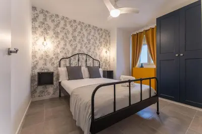 Cama o camas de una habitación en Apartamentos Turísticos Lulú