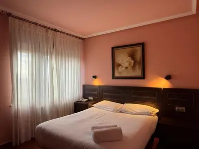 Cama o camas de una habitación en Hotel Santa Teresa