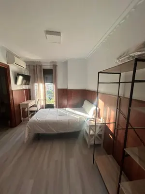 Cama o camas de una habitación en H La Posada