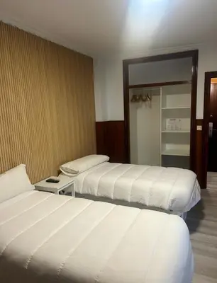 Cama o camas de una habitación en H La Posada