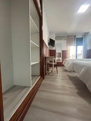 Cama o camas de una habitación en H La Posada