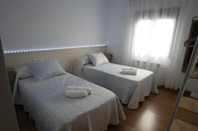 Cama o camas de una habitación en El desván de la vera AT-CC-00848