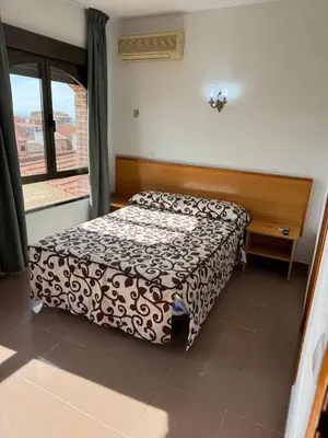 Cama o camas de una habitación en Hostal de Cazalegas